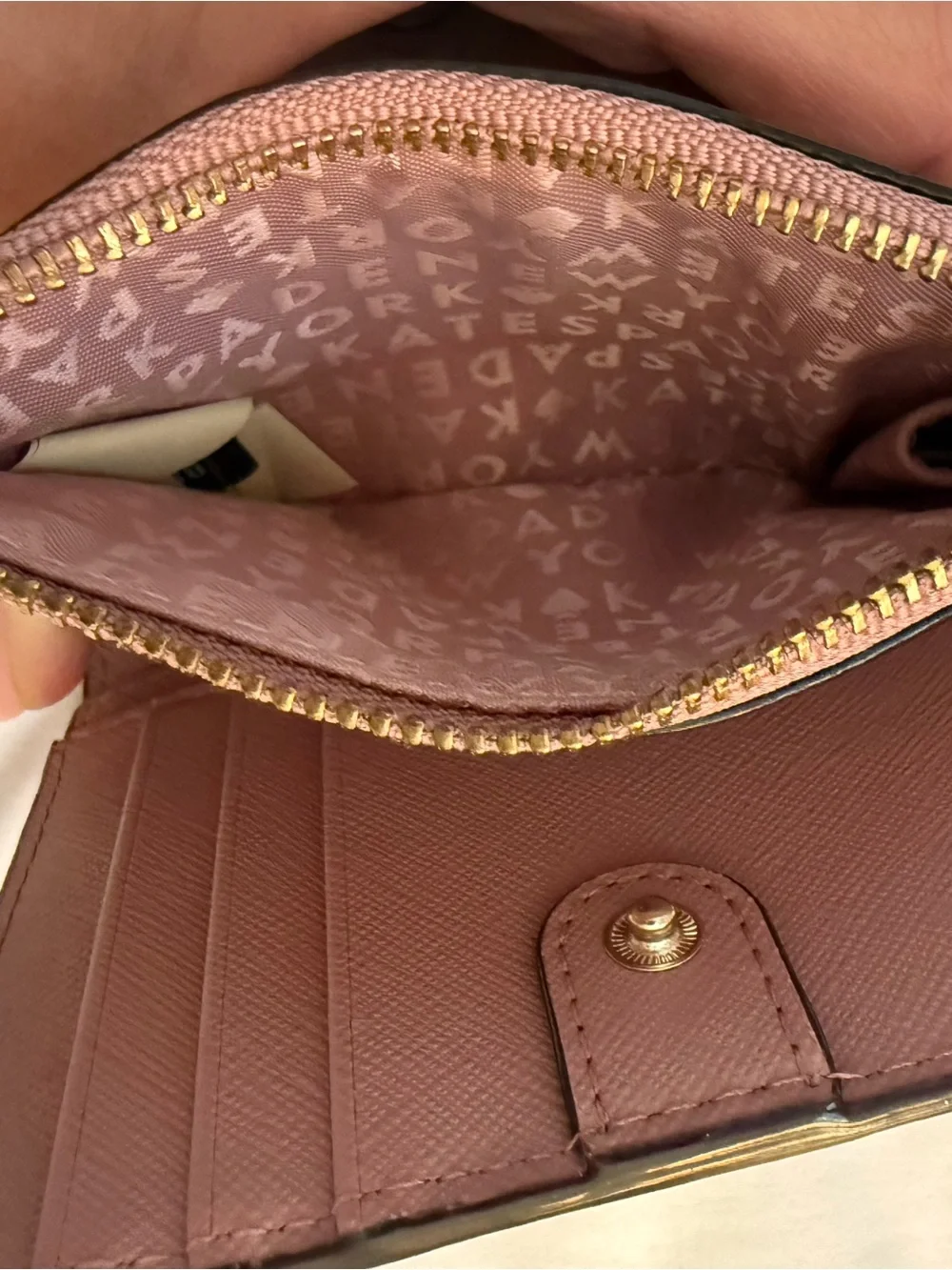 kate spade mauve pink leather zip wallet with gold plaque